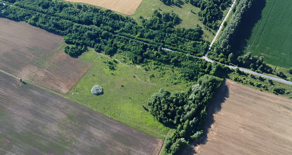 Aerial view of farmland, forest and roads
