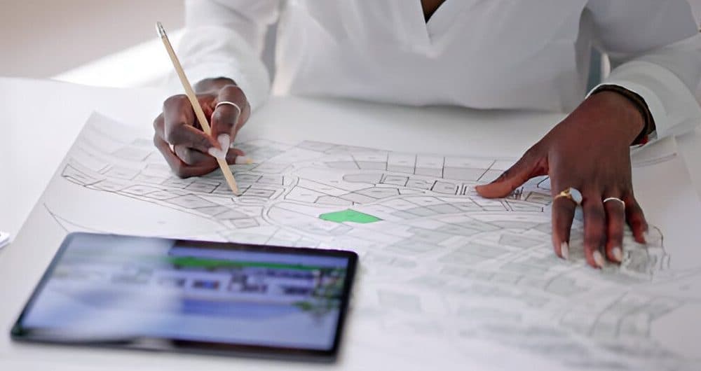 Surveyor drafting a survey plan